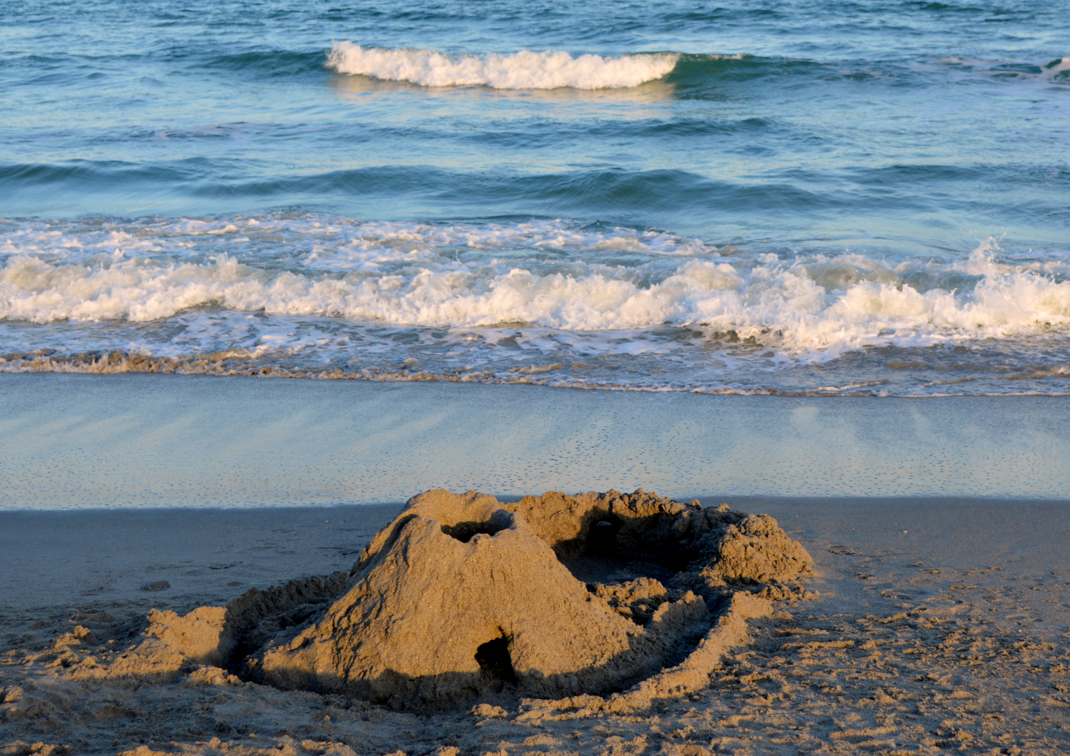 Sandcastle-with-water-approaching